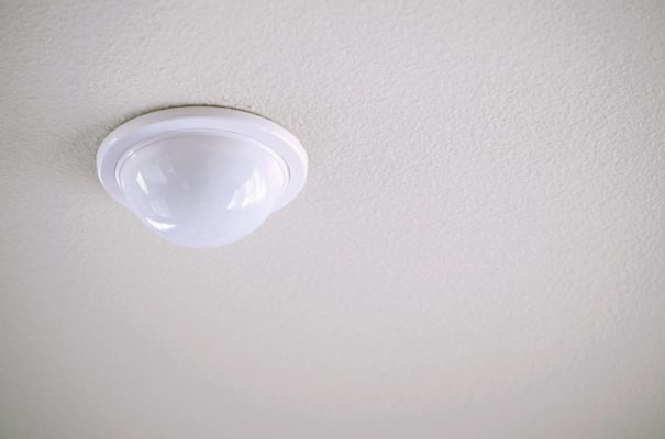 simple image of motion detector installed into a ceiling of a memory care community