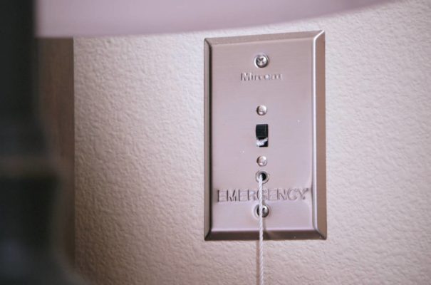 emergency pull cord installed into the wall of a memory care facility